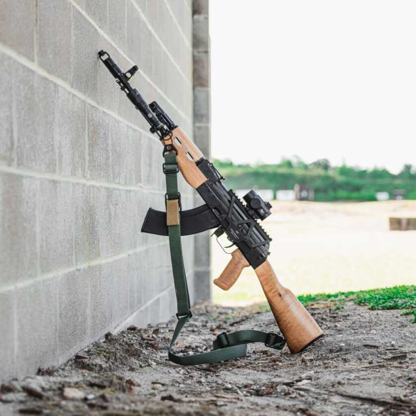 AK Buyers Guide AK Zastava M70 ZPAP rifle propped against cement wall