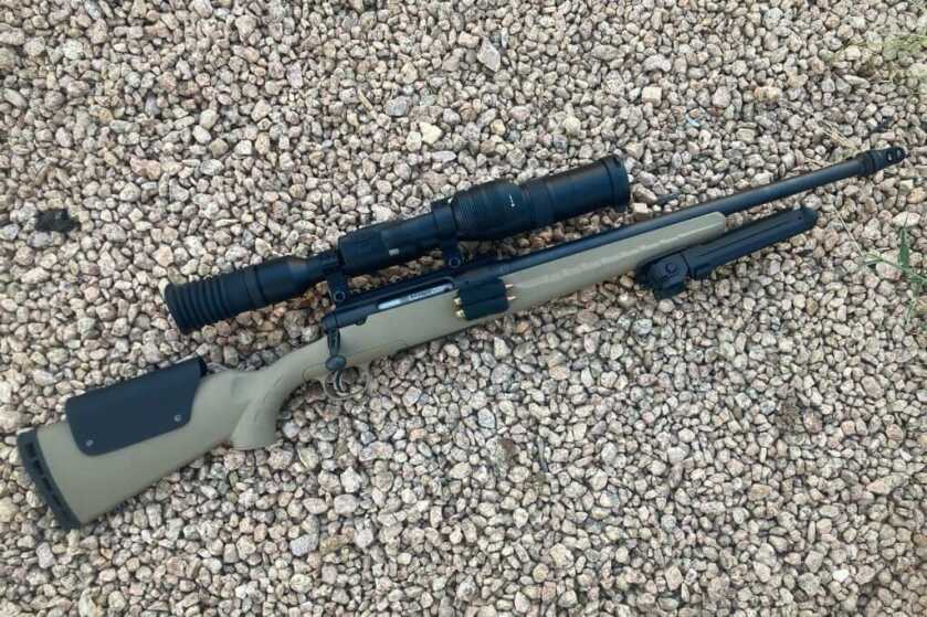 ATN X-Sight 5 LRF mounted on rifle. rocky background