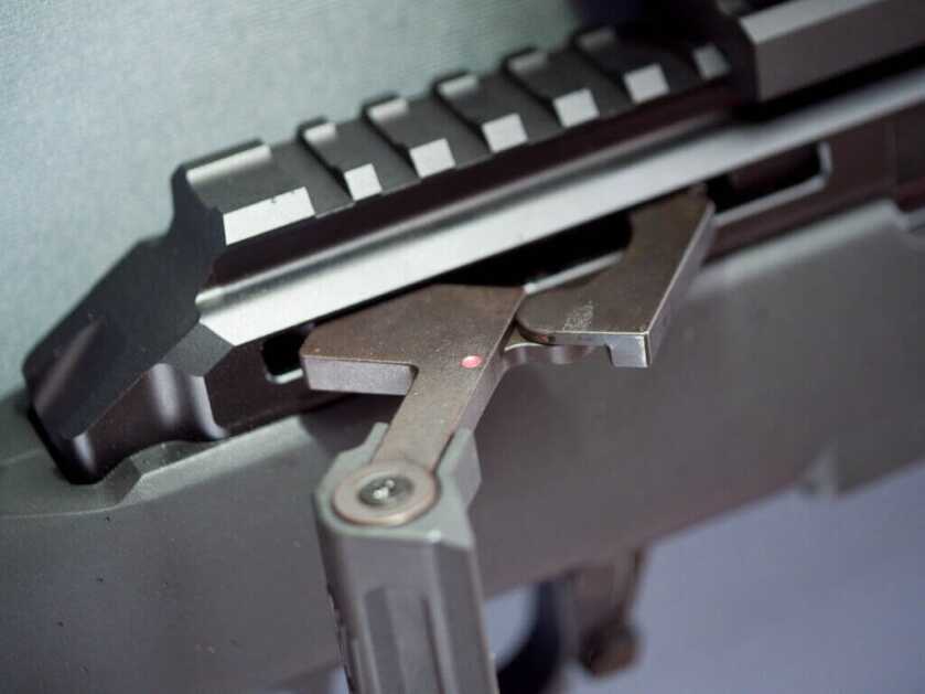 Close up view of the action and the pic rail. The gun is facing right.