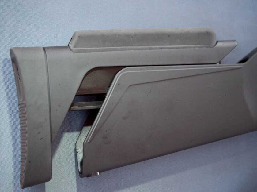 CLose up view of the butt stock. the gun is facing right.