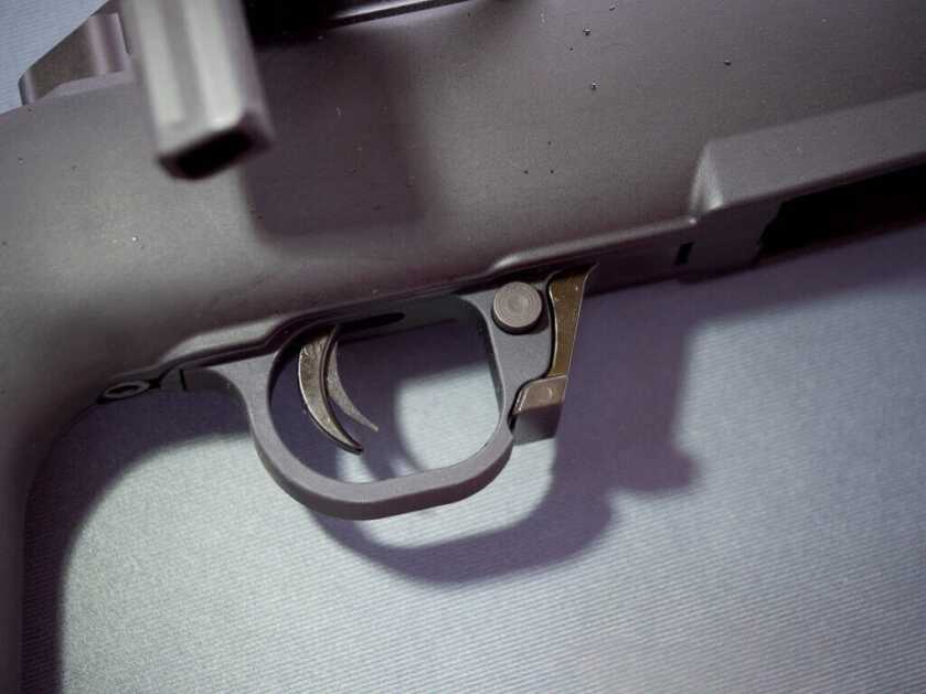 CLuse up view of the trigger and the safety and the magazine release.