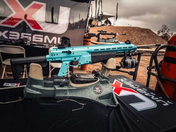 A blue air rifle is on display.