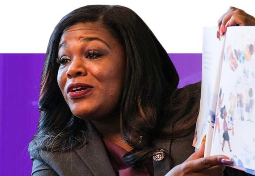 Cori Bush reading a children's book. 