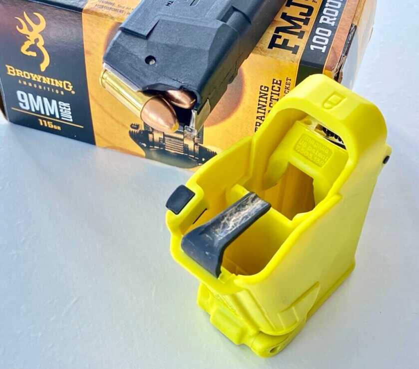 Loaded magazine next to Maglula UpLULA loader