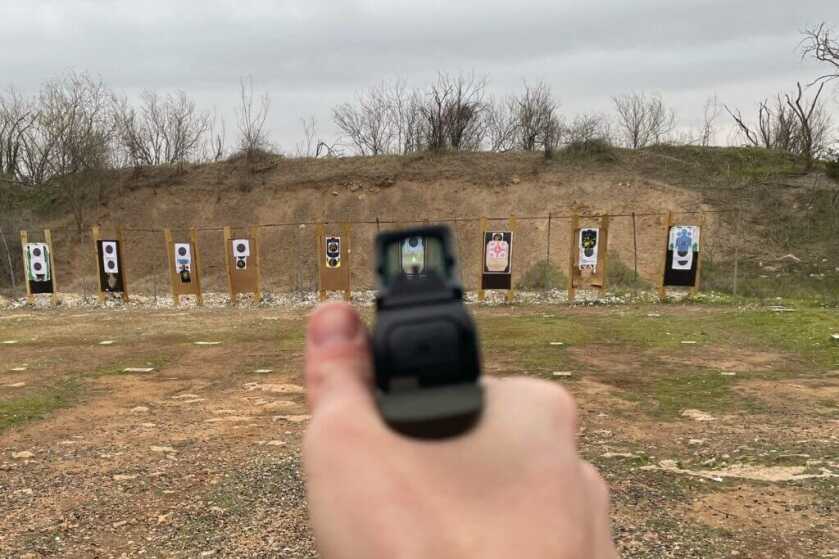 Looking through sight of Holosun SCS at the range