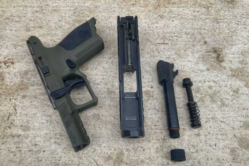 Beretta APX A1 Compact Tactical with Holosun SCS disassembled on concrete
