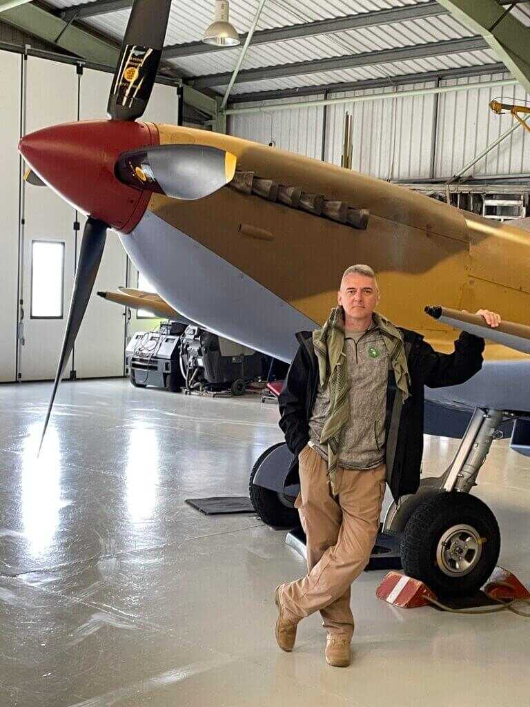 Author standing with WW2 armor after driving a Sherman tank
