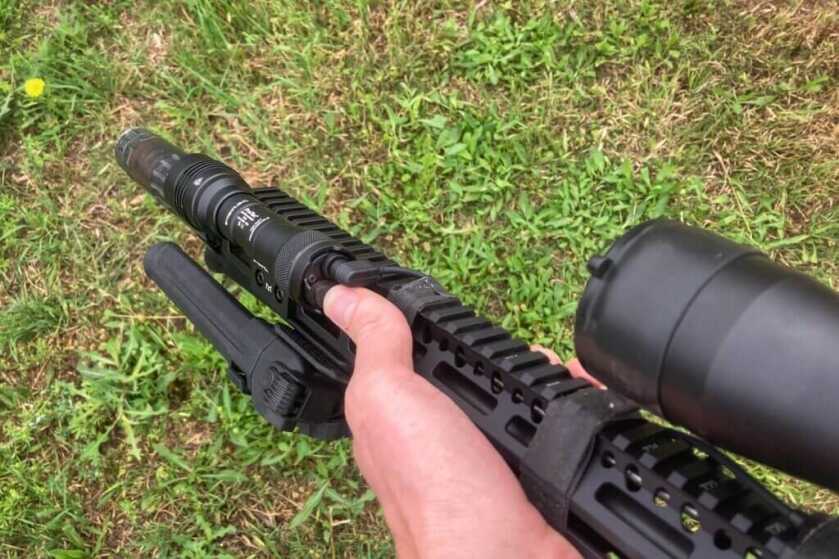 Streamlight HLX Pro mounted to the end of a rifle