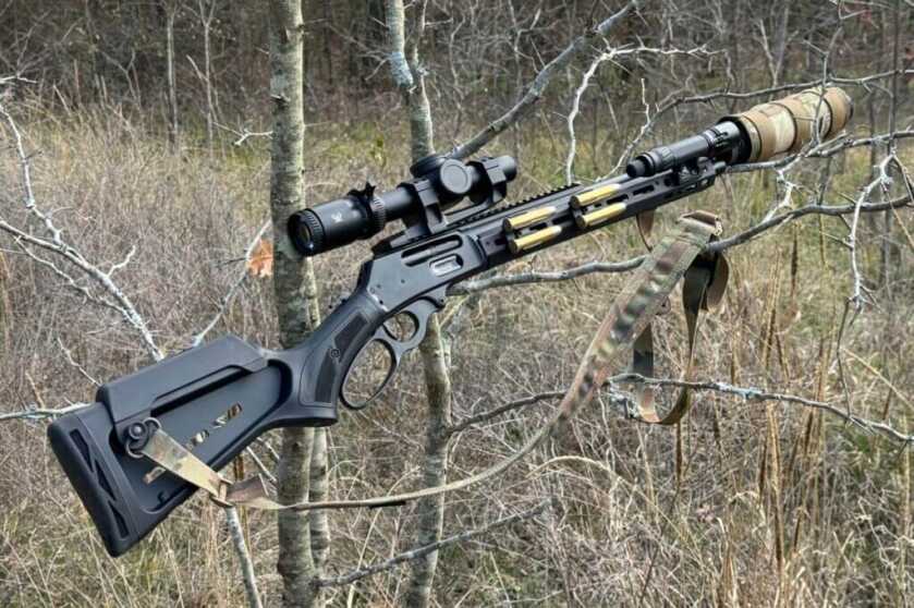 Camo gun sitting in the trees