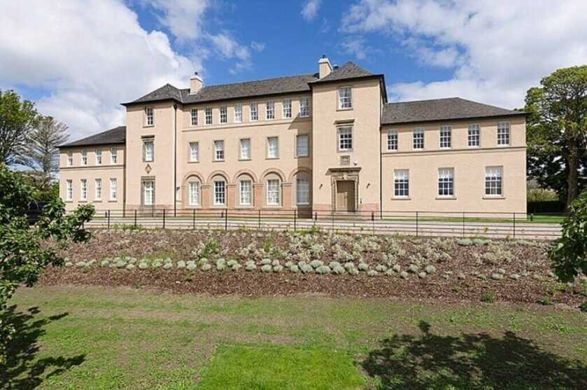 Old-fashioned prep school with maintained lawn