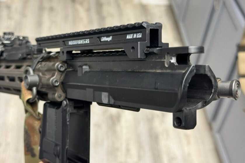 rifle with gear attached