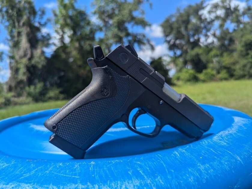 Smith & Wesson gun on blue barrel