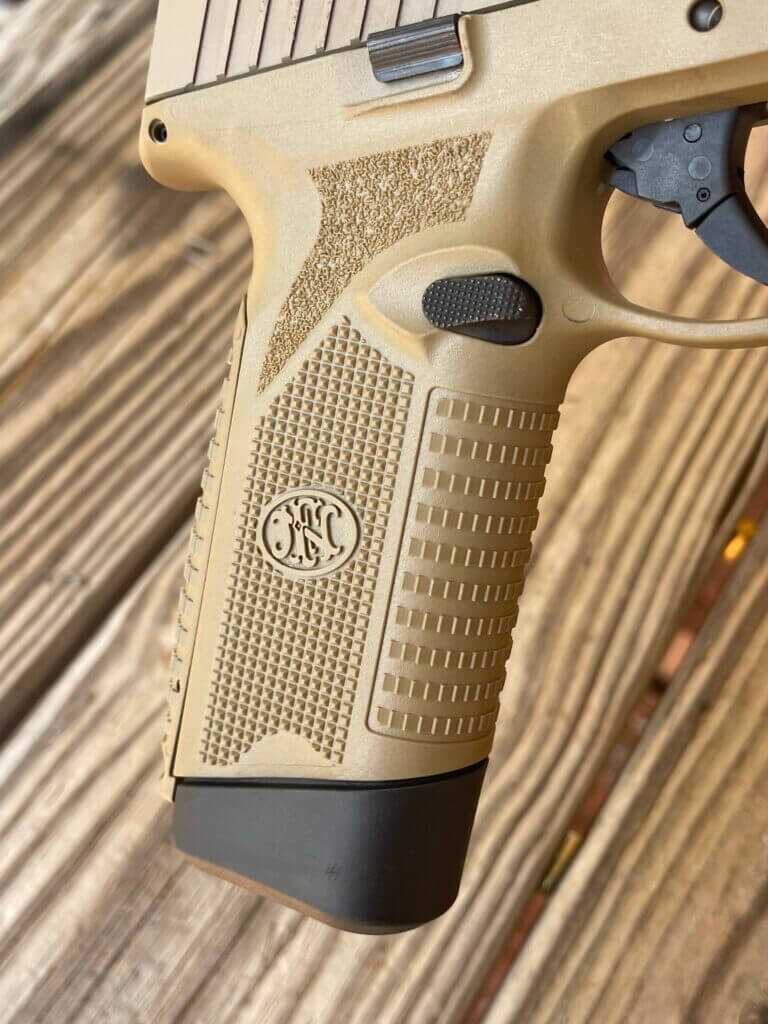 Grip texturing on gold handgun