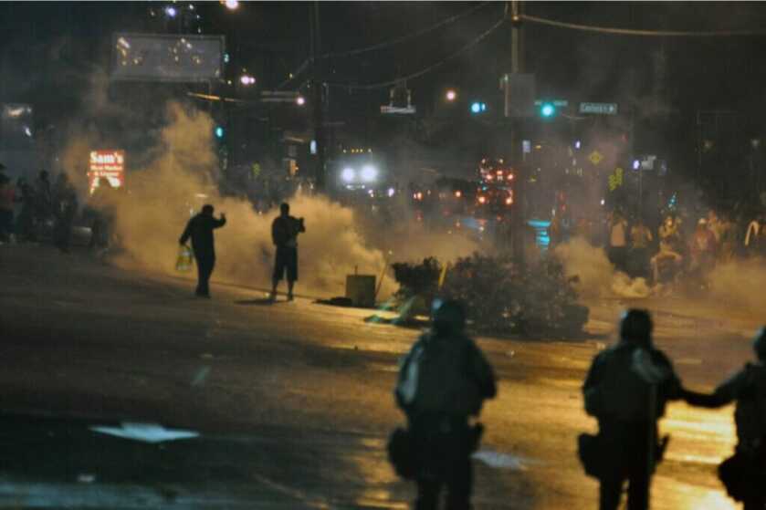 Ferguson Riots showing smoke and military men