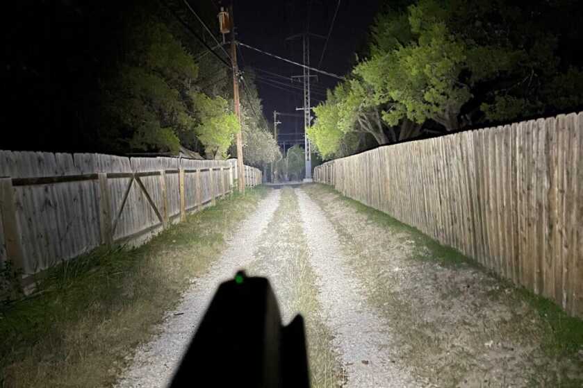 Weapon-mounted light illuminating driveway