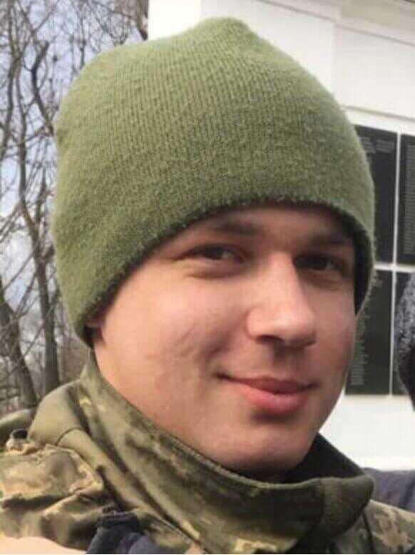 military man in green beanie