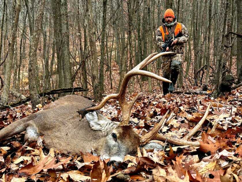 The author, approaching his buck after making a very difficult shot.