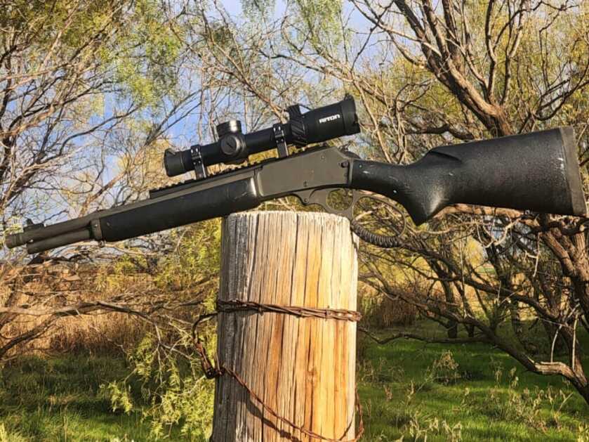 lever-action rifle on fence dark marlin 336