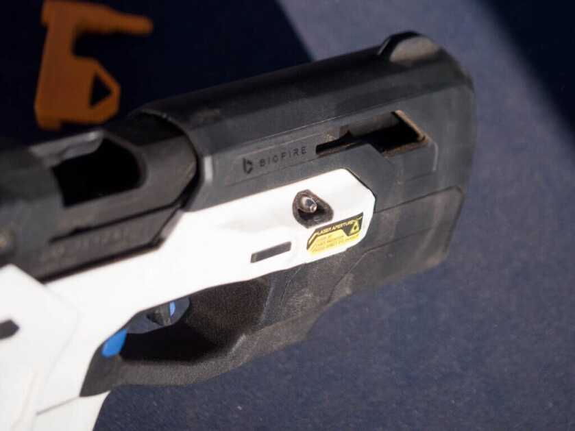 Close up showing the takedown pin on the right side of the gun.