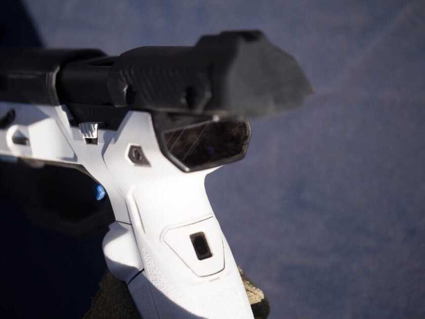 A view of the back of the gun with the slide open. The face sensor is visible at the top of the beavertail.