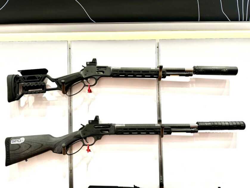 Two rifles are posed on a white background. They point to the right.