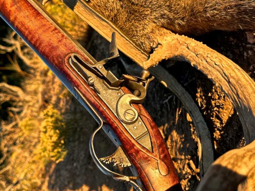 Close-up of Siler flintlock action striking sparks into priming pan on traditional .54 long rifle by Steve Baxter