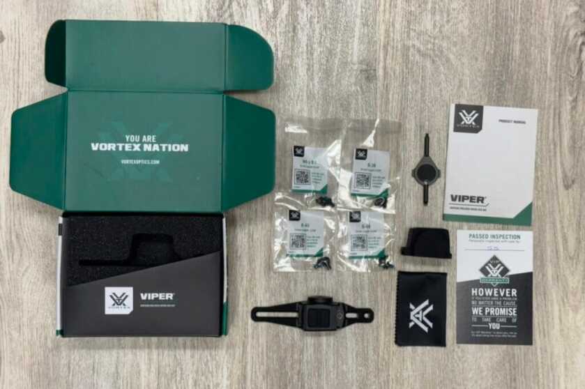 Unboxing a Vortex product on a wooden table