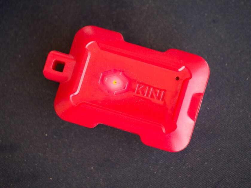 the kini device laying on a table.
