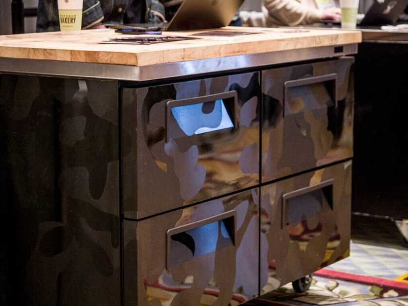 Freezer cabinet with drawers and a butcher-block top.