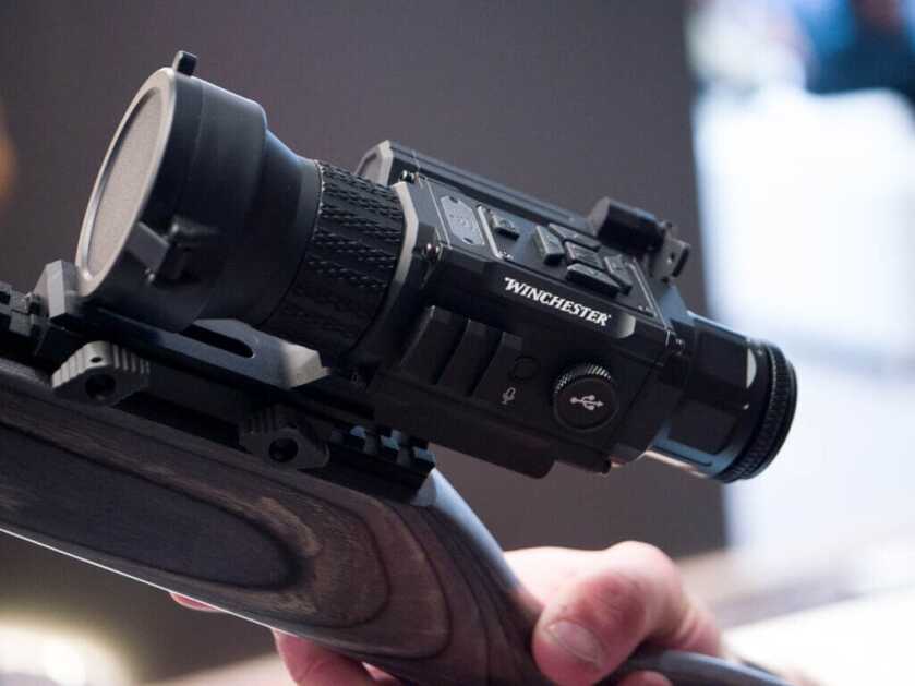 Winchester THSX-640 thermal hunting sight on display at SHOT Show 2025, close-up of optic body and controls highlighting rugged design and value.
