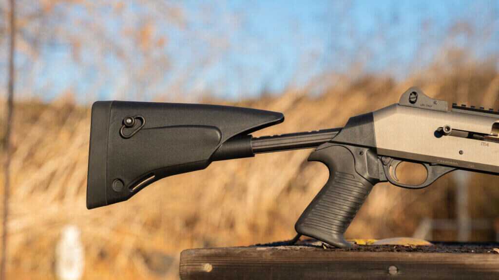 Closeup of Benelli M4 EXT oversized bolt release and pistol grip