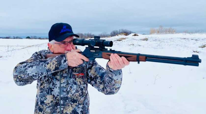 Marlin Model 336 in 30-30 being held by hunter in camo