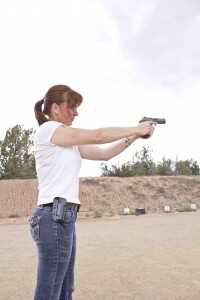 As you thrust the handgun towards the target, watch the laser to make sure you keep the handgun pointed at the target.
