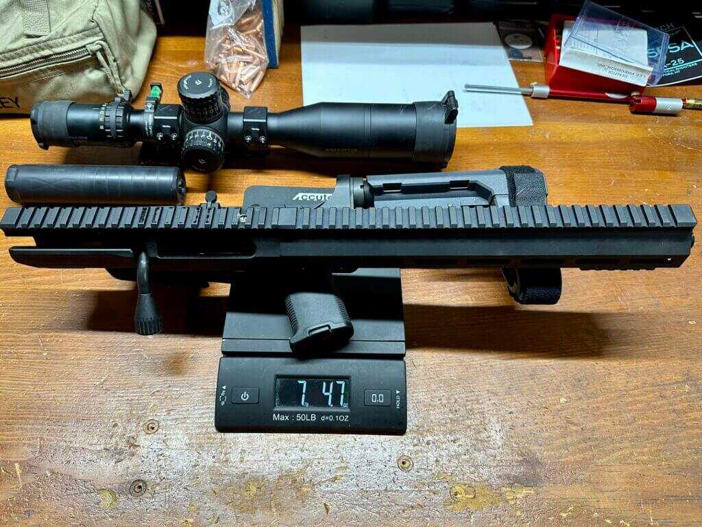 UP-10 12.5 inch 8.6 Blackout separated upper and lower on scale showing 7 lb 4.7 oz weight.