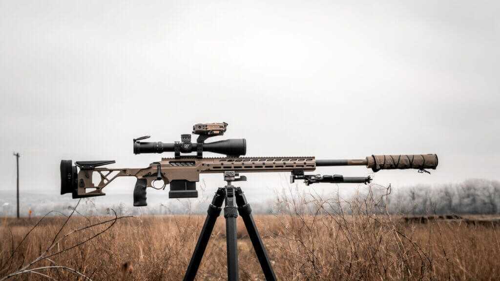 Seekins Precision SIC rifle in FDE on the line with optics and suppressor, field-ready precision setup
