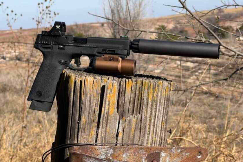 M&P22X configured with red dot, suppressor, and IR light and laser for night use