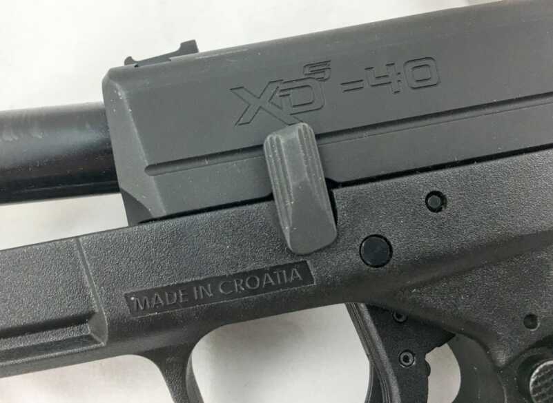 The takedown lever rotates up when the slide is locked back. This allows removal of the slide, barrel and recoil spring assembly.
