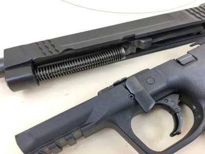 Field stripping is easy - just rotate the takedown lever to remove the slide assembly.