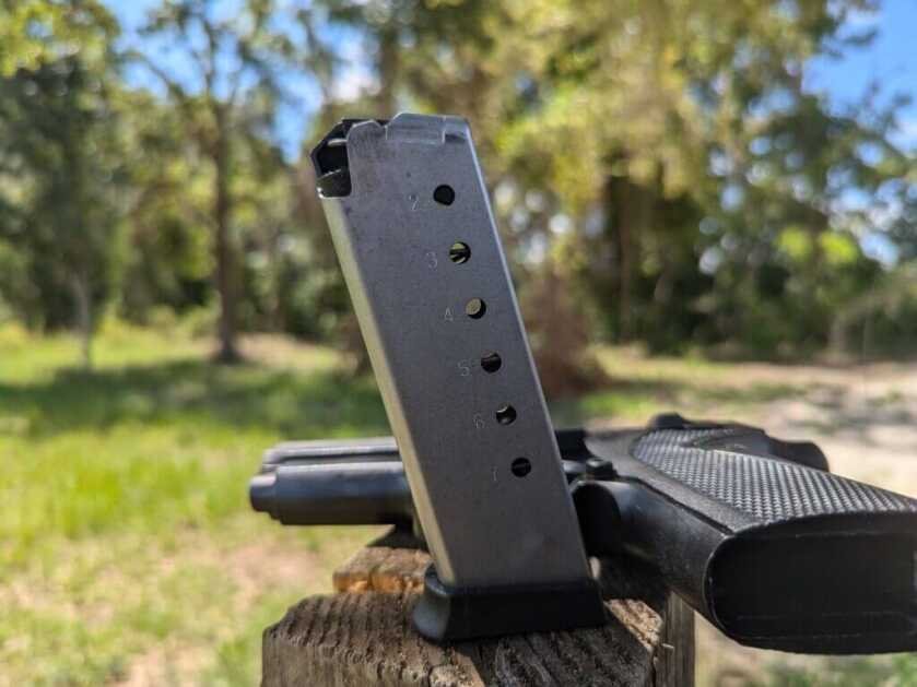 M1911 7-round magazine on wooden post