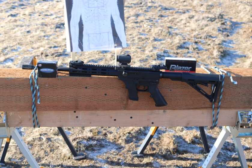 Thureon Defense 10mm carbine with red dot on a range bench