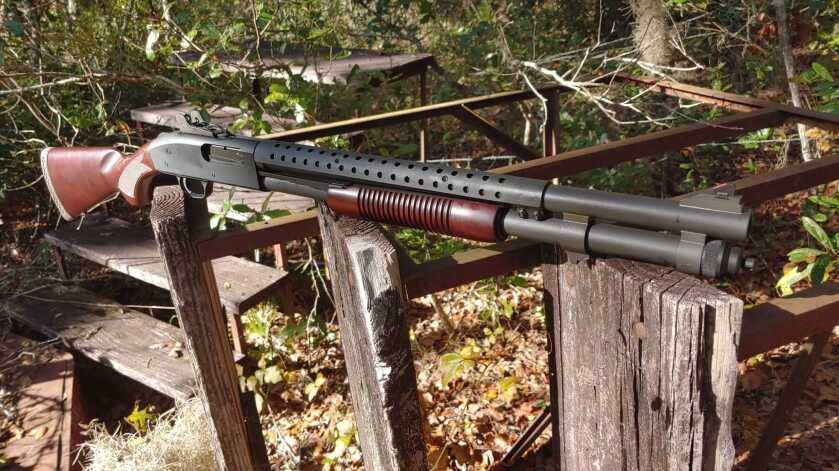 Mossberg 590A1 Retrograde pump shotgun with wood furniture and heat shield