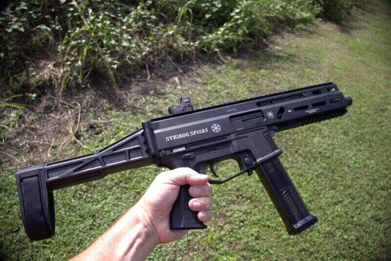 Grand Power Stribog SP10A3 10mm braced pistol held outdoors