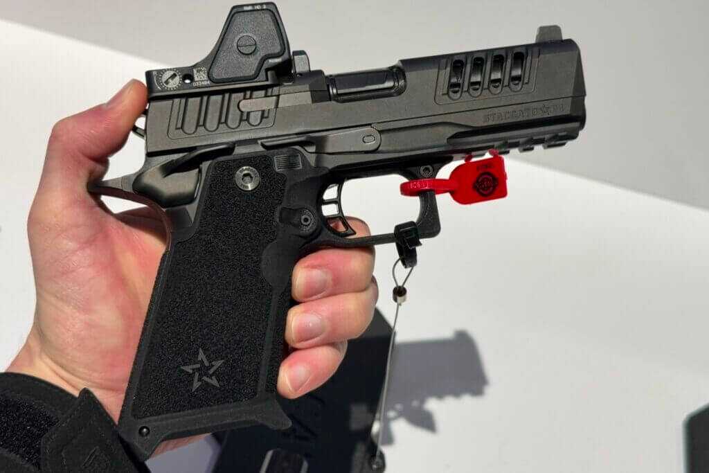 Staccato HD P4 2011 pistol with red dot optic held in hand at SHOT Show 2025
