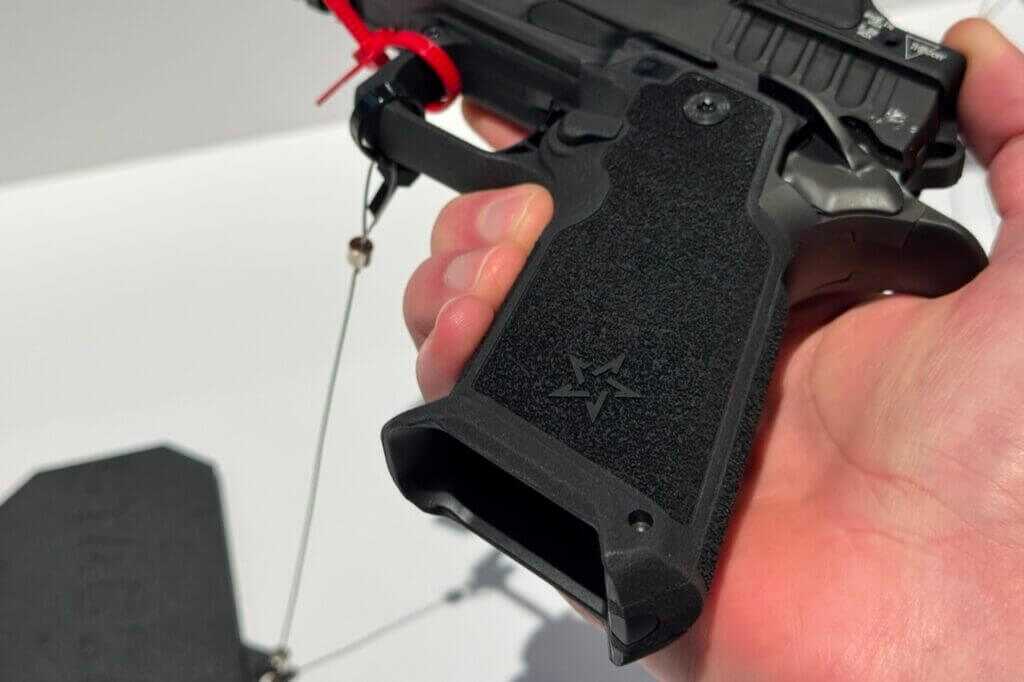 Bottom of a Staccato HD grip showing the magwell and a nearly flush magazine