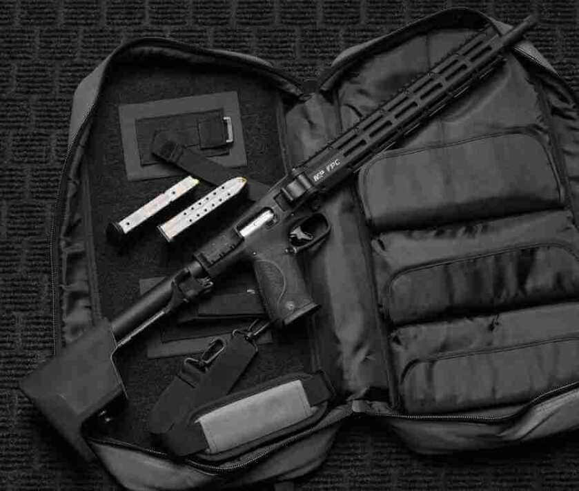 Smith and Wesson M&P FPC 10mm folding carbine laid out on a carry bag with magazines