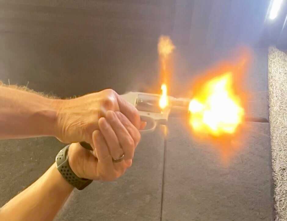 Smith and Wesson 642 UC revolver under recoil with upgraded defensive sights