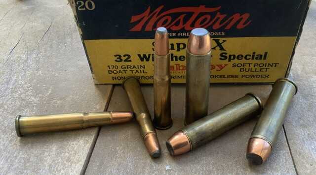 Side by side cartridges 32 Winchester Special and 50 Alaskan