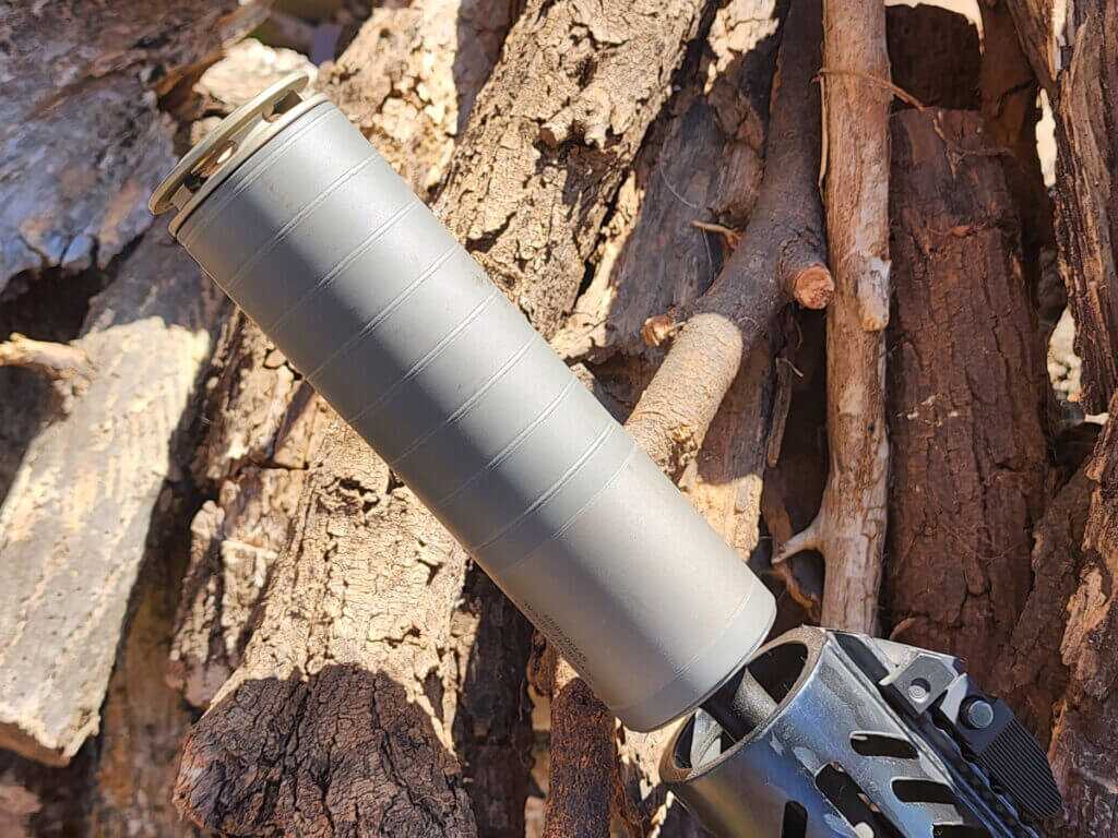 Rifle with SilencerCo Scythe Ti suppressor installed, showing slim 1.73 inch diameter for handguard clearance