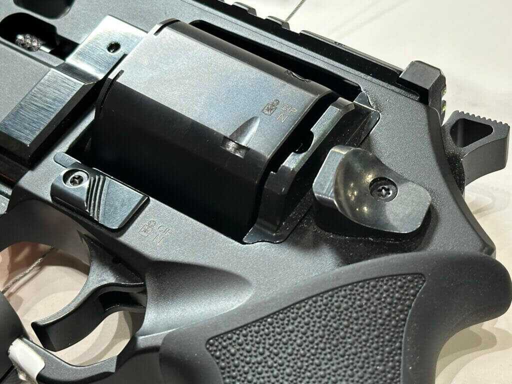 Closeup view of the cylinder and controls on a black revolver.