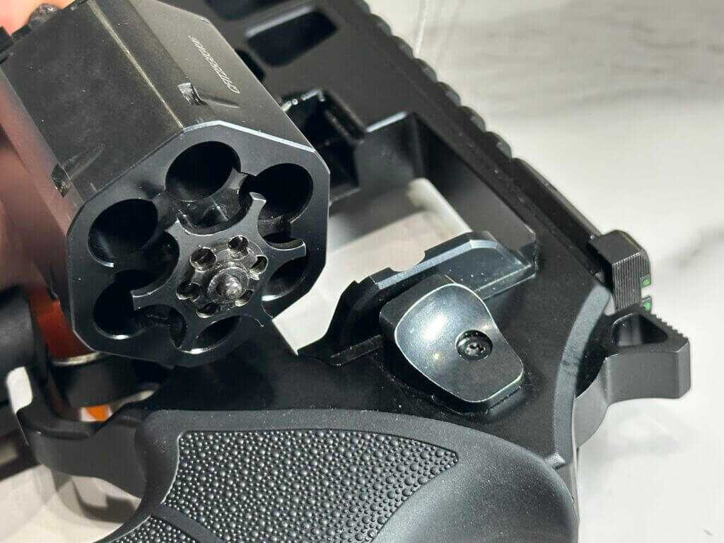 Closeup view of the cylinder and ejector of the Chiappa Rhino 44 Magnum.